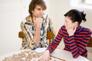 Couple with jigsaw puzzle